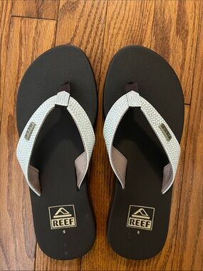 Reef Black Flip Flops with White Textured Straps